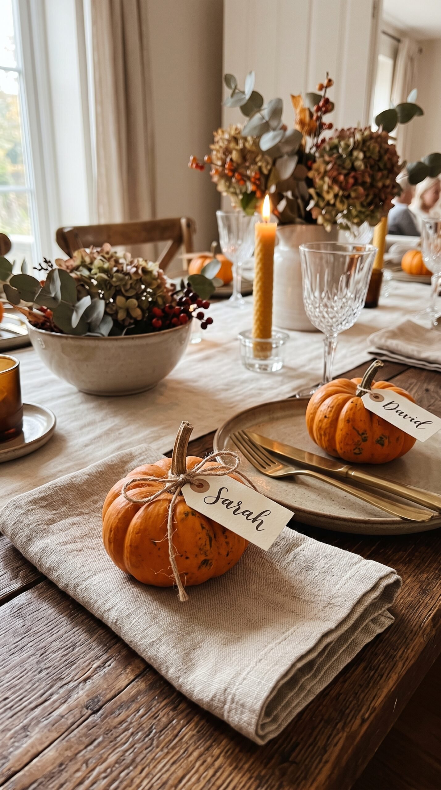 mini pumpkins used as place cards on a table